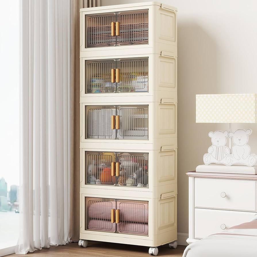Cream plastic storage tower with clear drawers and gold handles on wheels.