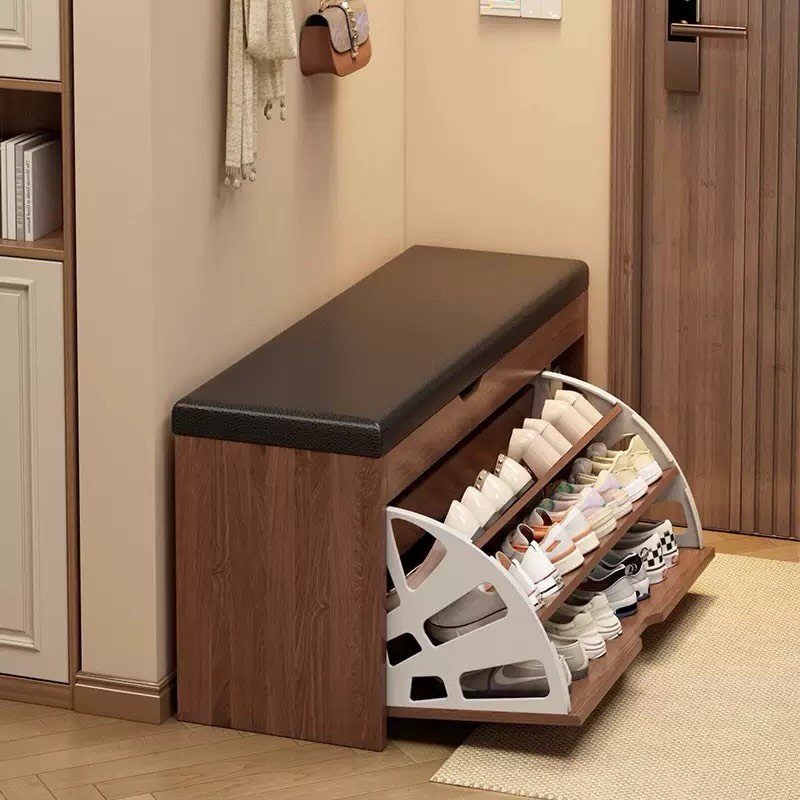 Brown wooden shoe storage bench with black seat and open tilt-out shoe drawer.