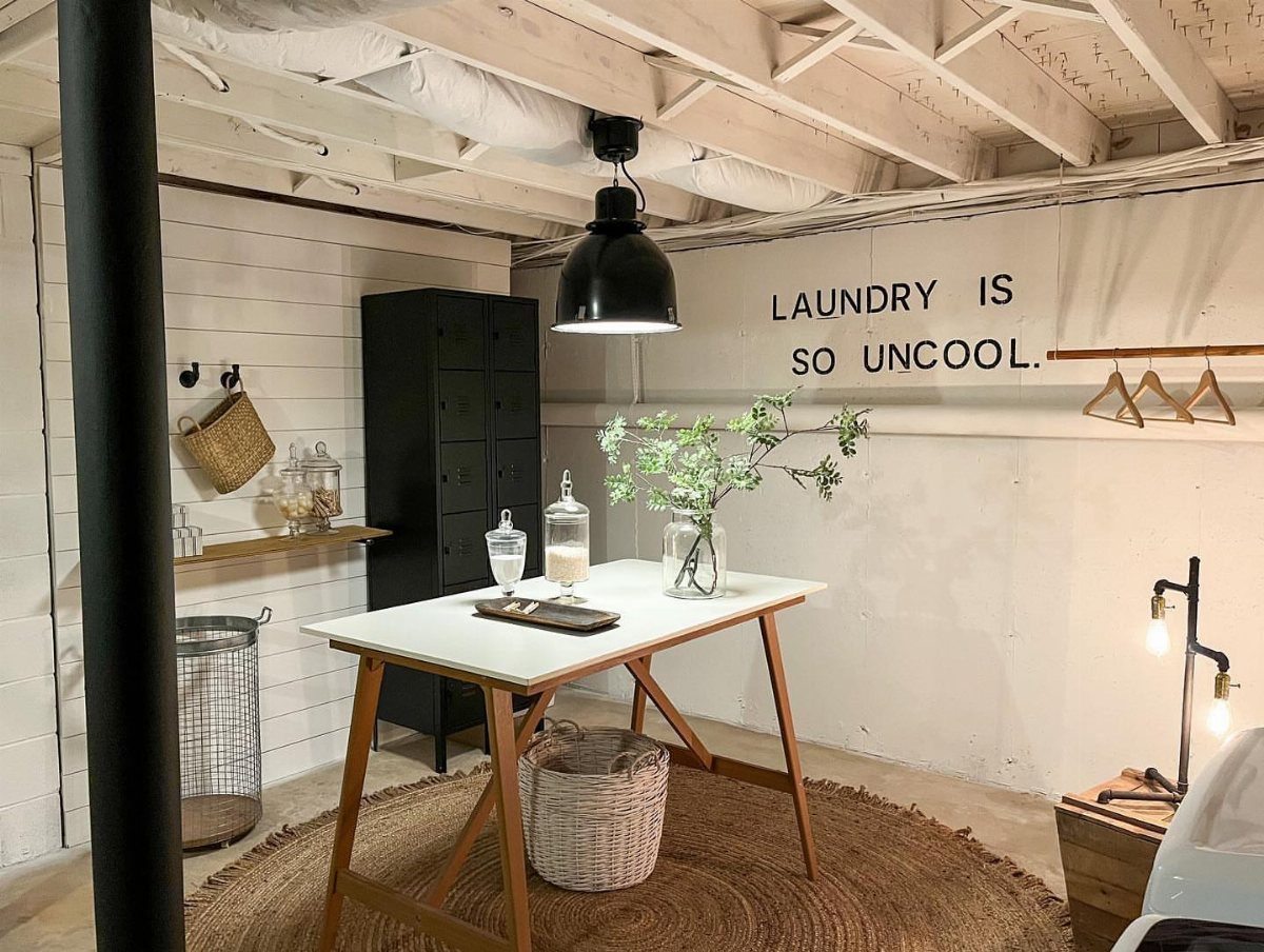 Round jute rug on the floor of a white basement laundry room.
