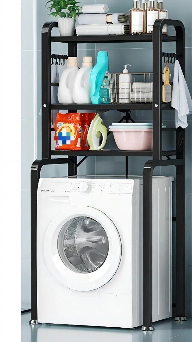 Black metal shelving unit over a white washing machine holding laundry supplies.