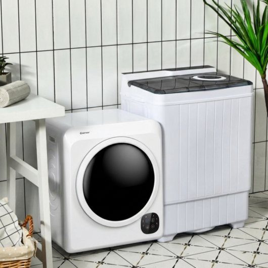 Two compact white laundry machines on a patterned tile floor against white tiles.