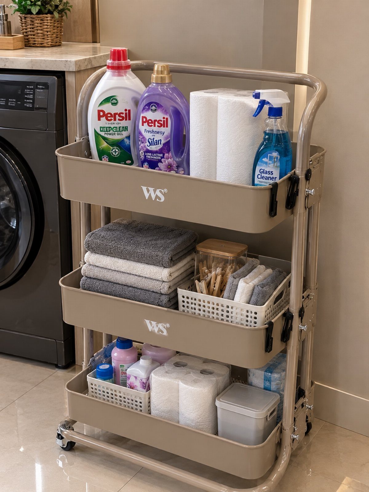 Beige rolling storage cart with laundry supplies and towels next to a washing machine.