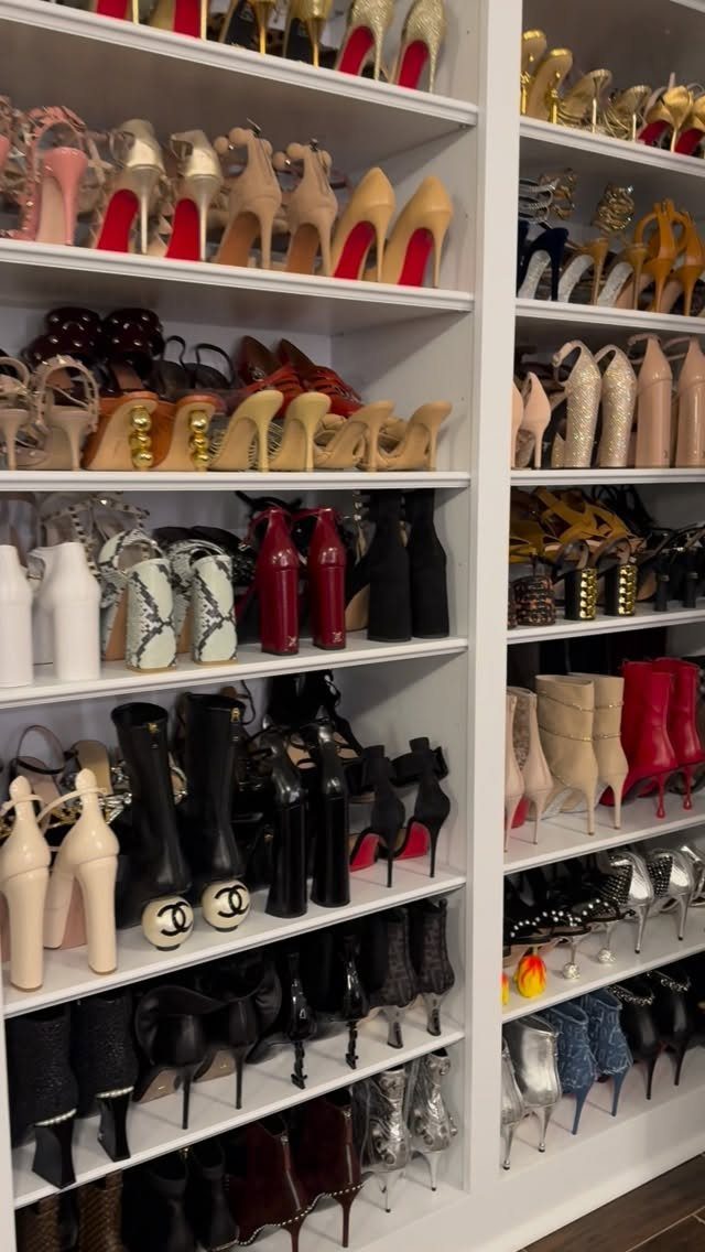 High-heeled shoes neatly arranged on white built-in closet shelves in various colors.