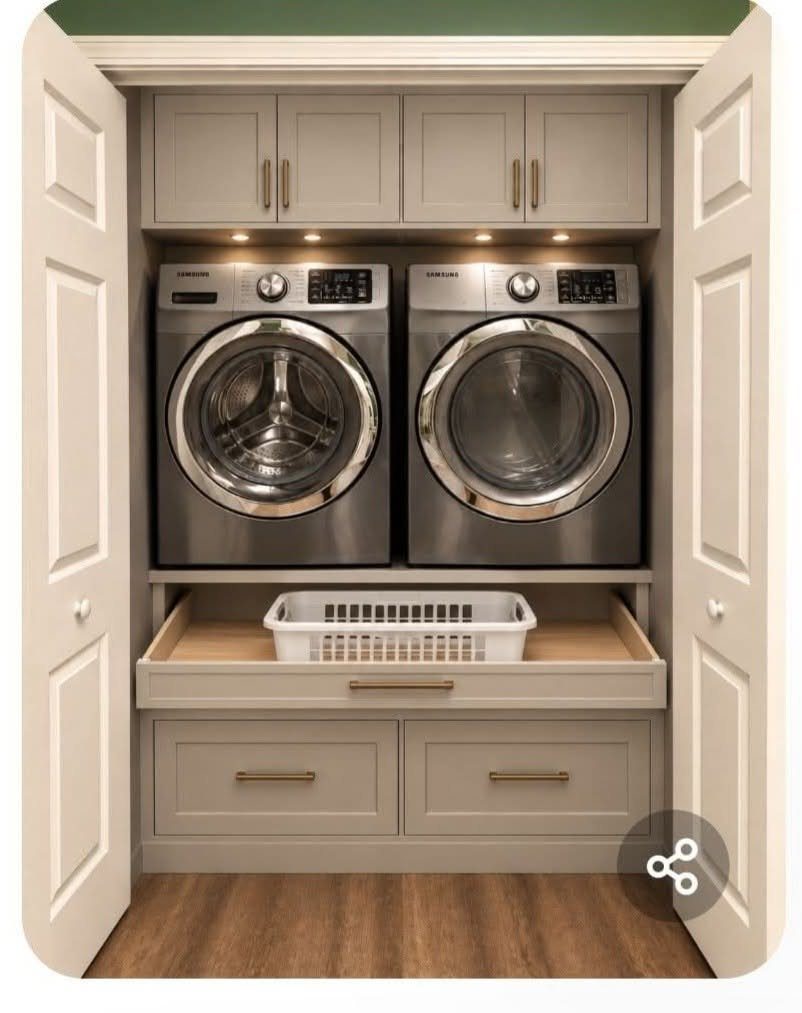 Silver side by side washer and dryer in a built-in grey laundry closet