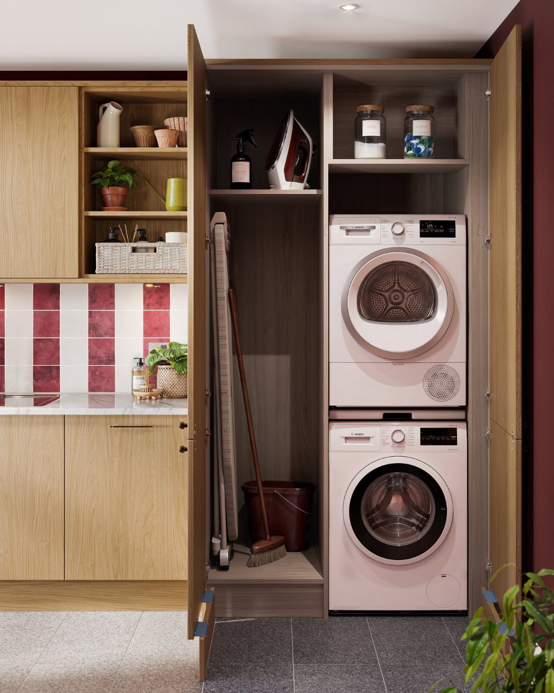 Stacked white washer and dryer inside a light wood laundry storage cabinet